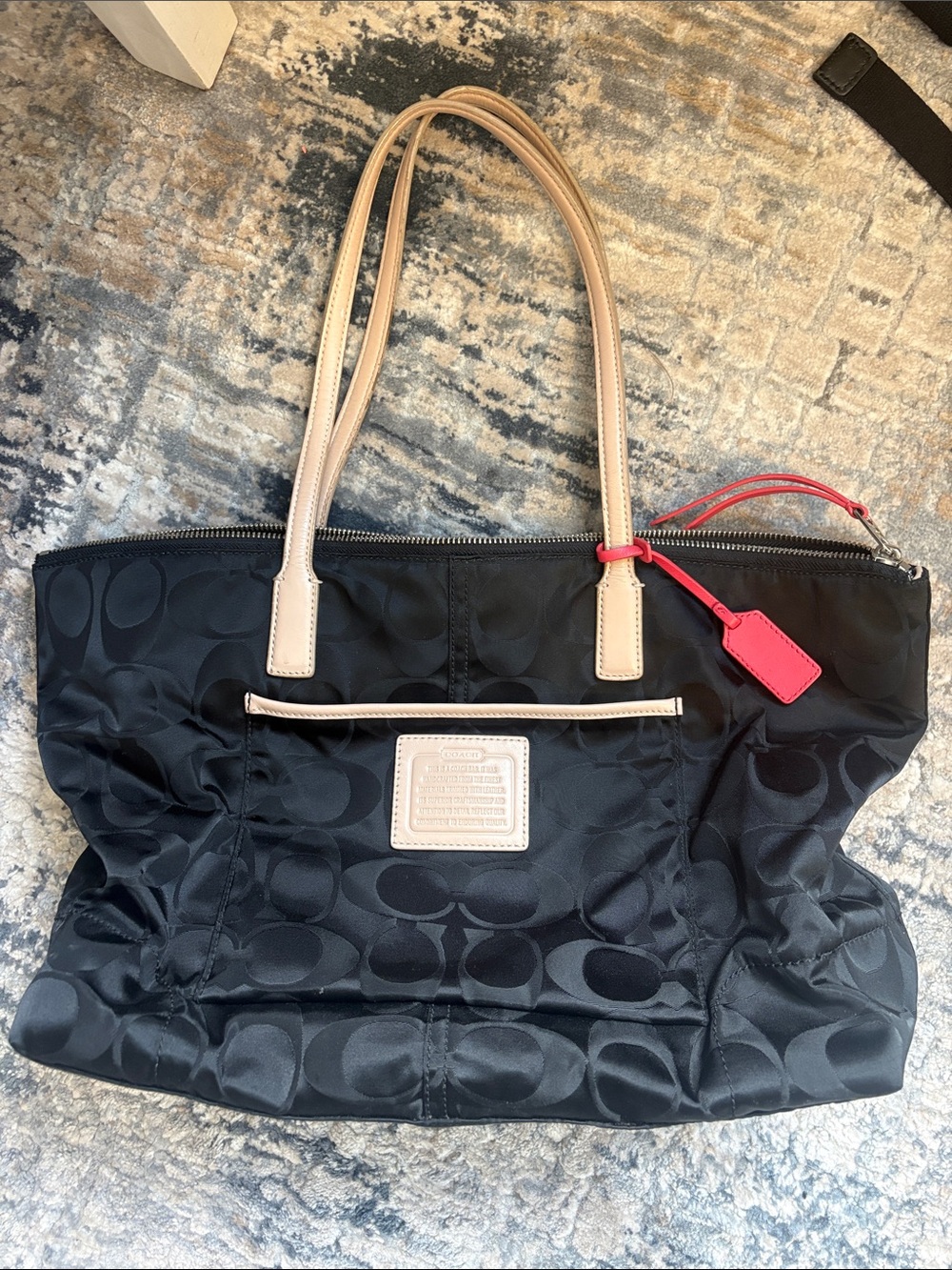 Coach Black Signature Tote with Beige Handles and Pink Hang Tag